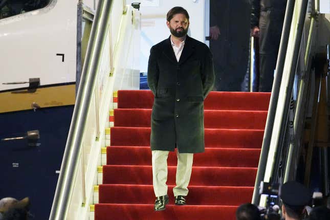 Chilean President Gabriel Boric arrives at Beijing&#39;s airport ahead of the Belt and Road Forum in the Chinese capital on Sunday, Oct. 15, 2023. (Ken Ishii/Pool Photo via AP)