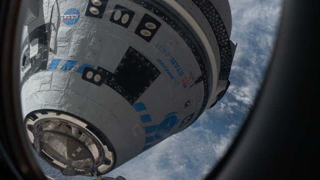 A photo of the Boeing Starliner craft docking with the ISS. 