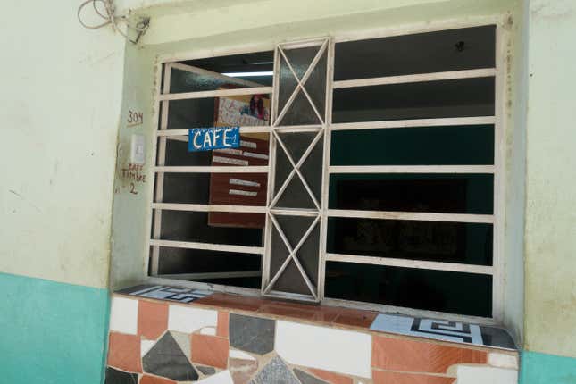 Signs like this one advertising homemade coffee are common throughout Havana.