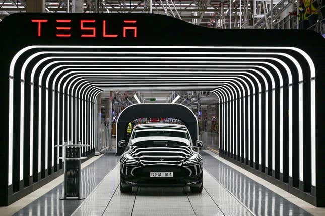 FILE - Model Y electric vehicles stand on a conveyor belt at the opening of the Tesla factory in Berlin Brandenburg in Gruenheide, Germany, Tuesday, March 22, 2022. Tesla production stands still because of The armed conflicts in the Red Sea and the associated shifts in transport routes between Europe and Asia. (Patrick Pleul/Pool via AP, File)