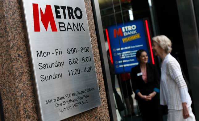 FILE - A potential customer walks into the first branch of the new British high street bank, the Metro Bank, in London, on July 29, 2010. Shares in the troubled British lender Metro Bank have bounced back by a third on reports that it has been sounding out bigger rivals to buy a chunk of its assets. Sky News reported Friday, Oct. 6, 2023, that advisers to the bank have contacted Lloyds Banking Group and NatWest Group among others. That helped the company’s share price rally by 30% to 48.5 pence on the London Stock Exchange. (AP Photo/Alastair Grant)