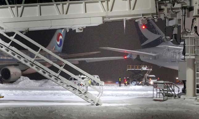 A Korean Air plane, left, and Cathay Pacific aircraft, right, are seen after a collision at northern Japan&#39;s New Chitose Airport in Sapporo, Tuesday, Jan. 16, 2024. A Korean Air plane carrying 289 people hit a parked Cathay Pacific aircraft while being pushed by a ground vehicle ahead of takeoff at northern Japan&#39;s New Chitose Airport on Tuesday but caused no fire or injuries, fire and airline officials said. (Kyodo News via AP)