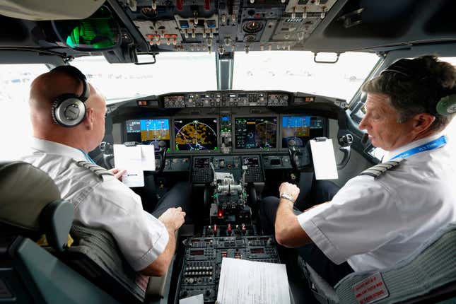 FILE - American Airlines pilot captain Pete Gamble, left, and first officer John Konstanzer conduct a pre-flight check before taking off from Dallas Fort Worth airport on Dec. 2, 2020, in Grapevine, Texas. The Federal Aviation Administration is warning against raising the mandatory retirement age for airline pilots. The FAA says it needs to study the safety implications before raising the age. FAA Administrator Mike Whitaker told key senators about the agency&#39;s view of the issue in a letter that was made public late Monday, Feb. 5, 2024. The House voted last year to raise the retirement age from 65 to 67 as part of a larger bill covering FAA operations. A Senate committee is scheduled to take up its version of the bill later this week. (AP Photo/LM Otero, File)