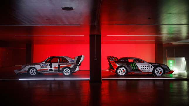 A photo of two Audi race cars parked back to back.