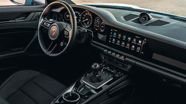 Interior of a Porsche 911, looking at the driver's side from the passenger seat.