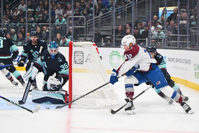 Nov 13, 2023; Seattle, Washington, USA; Seattle Kraken goaltender Joey Daccord (35) blocks a goal shot by Colorado Avalanche center Ross Colton (20) during the first period at Climate Pledge Arena.