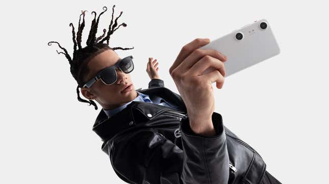 The XReal Beam Pro with a person wearing the XReal Air 2 glasses.