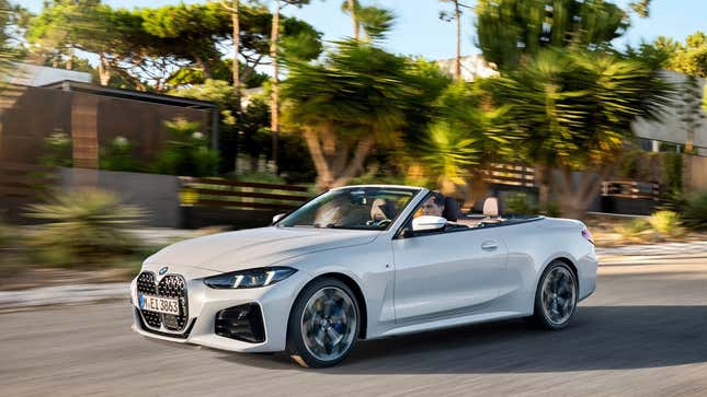 A photo of a white BMW 4 Series convertible. 