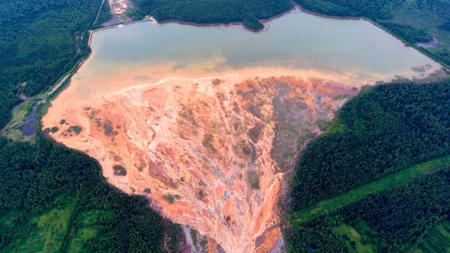 An aerial view taken on June 27, 2020, shows colored rivers near a disused copper-sulphide mine near the Russian village called Lyovikha in the Urals.