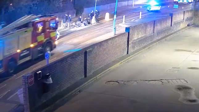 A fire engine approaches the site of a fake crash