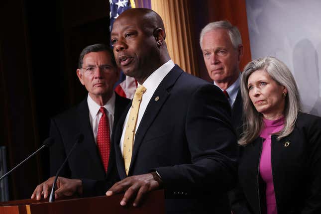 Sen. Tim Scott (R-SC) (2nd L) speaks to reporters during a news conference with (L-R) Sen. John Barrasso (R-WY), Sen. Ron Johnson (R-WI), and Sen. Joni Ernst (R-IA) at the U.S. Capitol on July 21, 2021, in Washington, DC. Sen. Lindsey Graham (R-SC) organized the news conference to criticize what he called the Senate Democrats’ ‘spending spree.’ 