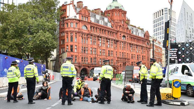 Insulate Britain activists block a road in England.