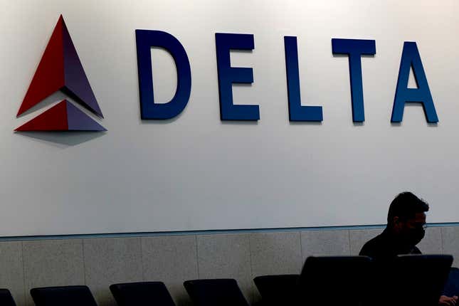 FILE - A man waits for a Delta Air Lines flight at Hartsfield-Jackson International Airport in Atlanta, Jan. 7, 2022. An emergency slide fell off a Delta plane that was taking off from New York&#39;s John F. Kennedy International Airport, Friday, April 26, 2024. The pilots returned to the airport and landed safely. (AP Photo/Charlie Riedel, File)