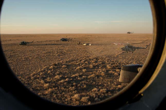 Search and rescue team approaches the Soyuz TMA-20M spacecraft capsule after its landing near the town of Zhezkazgan (Dzhezkazgan), Kazakhstan