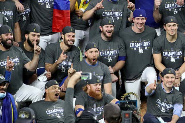 Justin Turner joined his teammates for post-game celebrations despite being removed from the World Series clinching game due to COVID-19.