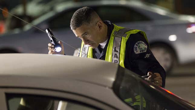 An officer with the Los Angeles Police Department checks the sobriety of a driver in Hollywood over the Memorial Day weekend.