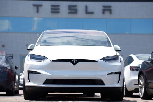 FILE - An Unsold 2023 Model X sports-utility vehicle sits outside a Tesla dealership Sunday, June 18, 2023, in Englewood, Colo. Tesla sales are expected to fall in the first quarter as demand for electric vehicles continues to slow. (AP Photo/David Zalubowski, File)