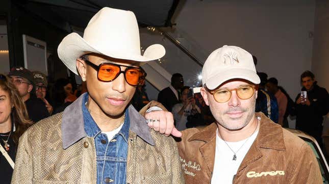 Williams, pictured here with artist Daniel Arsham, at the Joopiter Joy Ride launch party