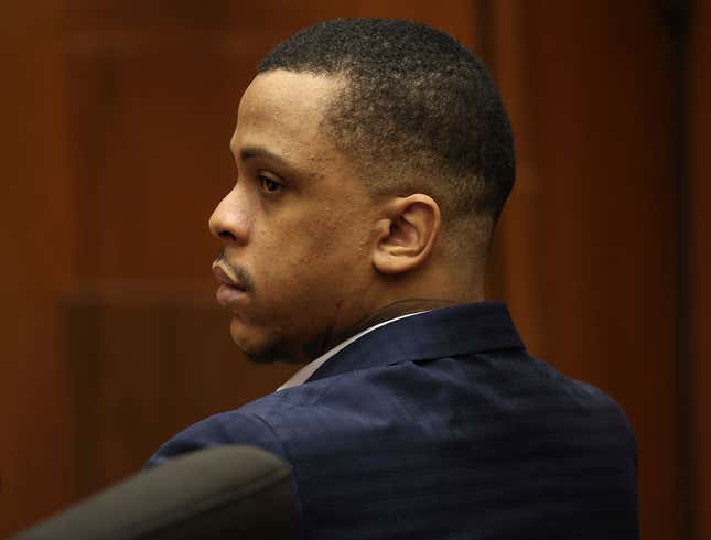 Defendant Eric Holder listens during opening statements in his murder trial, Wednesday, June 15, 2022, at Los Angeles Superior Court in Los Angeles. Holder, 32, faces one count of first degree-murder and two counts of attempted first-degree murder for the killing the Grammy Award-winning rapper Nipsey Hussle outside his clothing store three years ago.