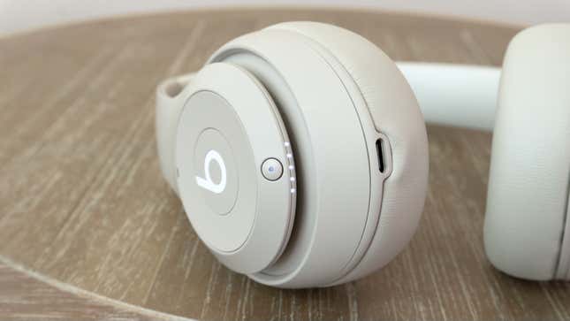 A close-up of the power and function button on the Beats Studio Pro wireless headphone's right earcup.