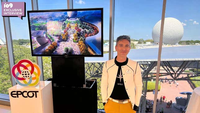 Zach Riddley standing in front of an Epcot monitor with Spaceship Earth in the background.
