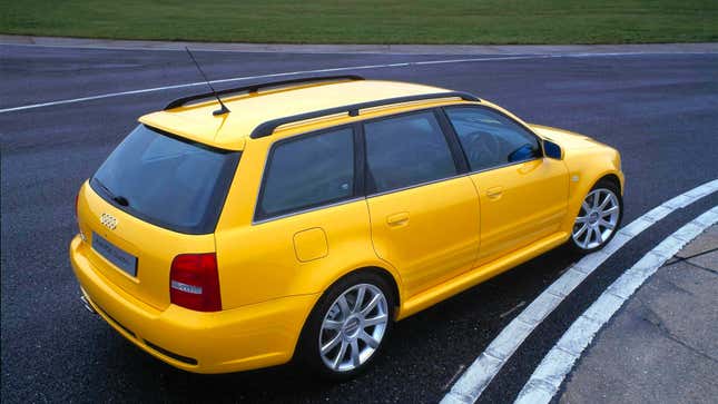 A photo of a yellow Audi RS wagon on a track. 