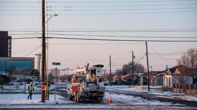 An Oncor Electric Delivery crew works on restoring power to a neighborhood following the winter storm that passed through Texas Thursday, Feb. 18, 2021, in Odessa, Texas. 