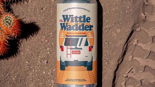 A photo of the Wittle Wadder beer can on dirt next to a cactus