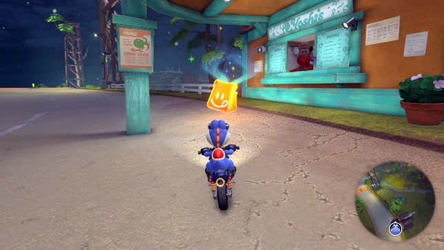 Yoshi sits on a bike outside of a restaraunt.