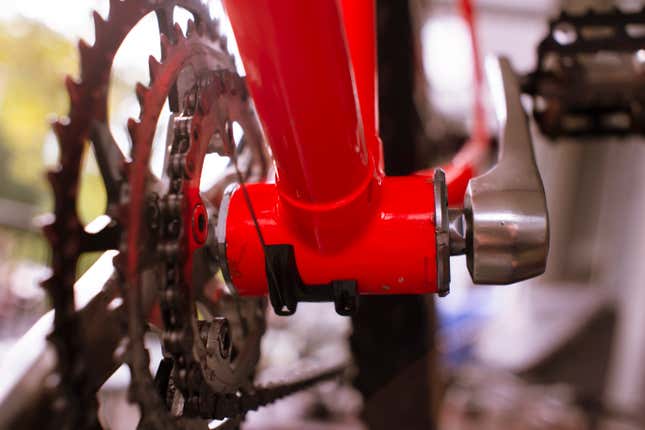 Looking back from the front of the bike. Fully assembled, you can see the cranks fix onto the spindle, held with cups on either side of the frame. The bearings rest inside the frame itself.
