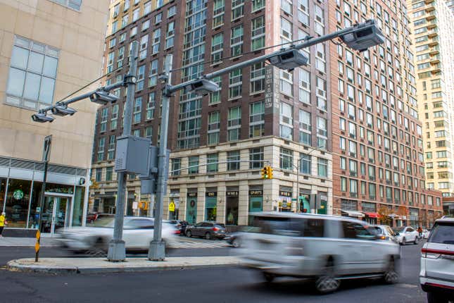 FILE - Recently installed toll traffic cameras hang above West End Ave. near 61st Street in the Manhattan borough of New York, Friday, Nov. 16, 2023. The start date for the $15 toll most drivers will be charged to enter Manhattan&#39;s central business district will be June 30, transit officials said Friday, April 26, 2024. (AP Photo/Ted Shaffrey, File)