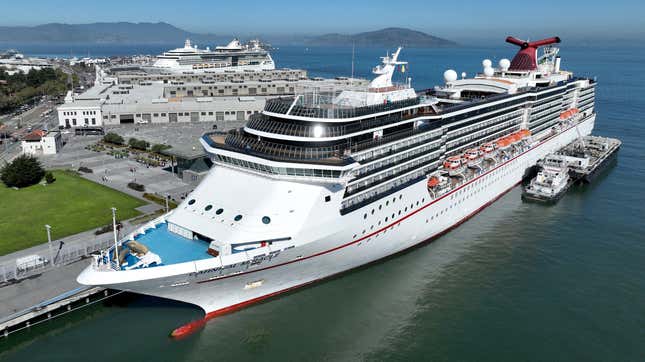 In an aerial view, the Carnival Miracle cruise ship operated by Carnival Cruise Lines sits docked at Pier 27 on September 30, 2022 in San Francisco, California.