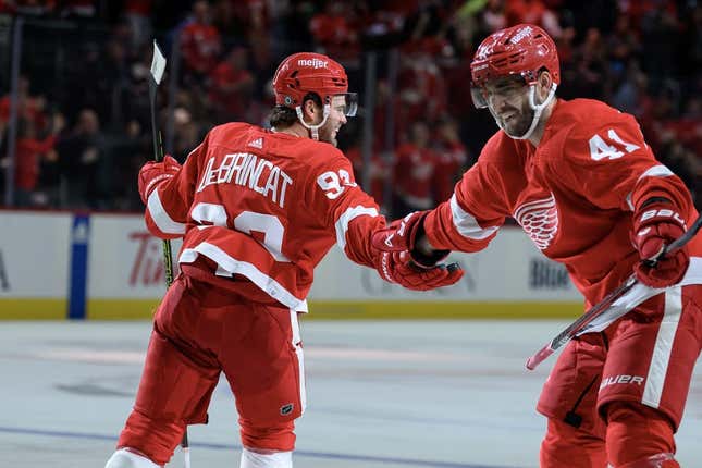 Oct 24, 2023; Detroit, Michigan, USA; Detroit Red Wings right wing Alex DeBrincat (93) celebrates with defenseman Shayne Gostisbehere (41)after scoring a power play goal against the Seattle Kraken in the third period at Little Caesars Arena.