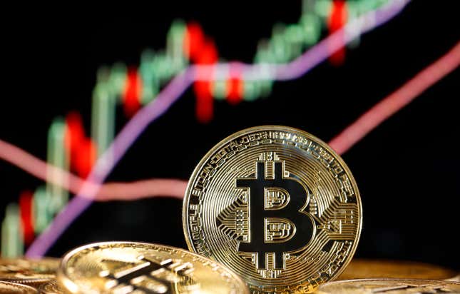 Image for article titled Bitcoin falls back, Dogecoin soars, and stocks hit new highs: Markets news roundup