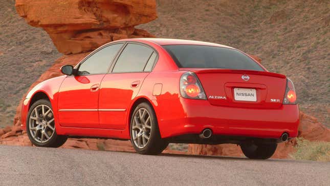 Photo of a red Nissan Altima SE-R from the rear quarter