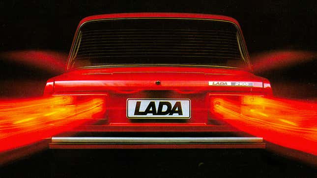 An image of the rear of a Lada car with blurred tail lights. 