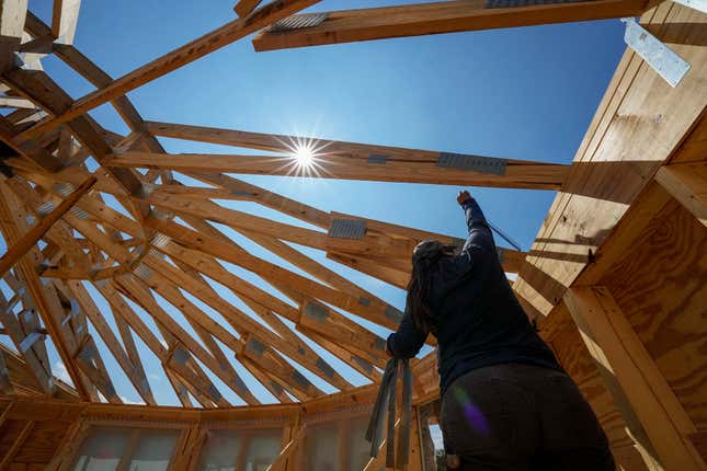 File - Workers build a home on Sept. 19, 2023, in Marshall, N.C. On Wednesday, Jan. 31, 2024, the Labor Department reports on wages and benefits for U.S. workers during the last quarter of 2023. (AP Photo/Chris Carlson, File)