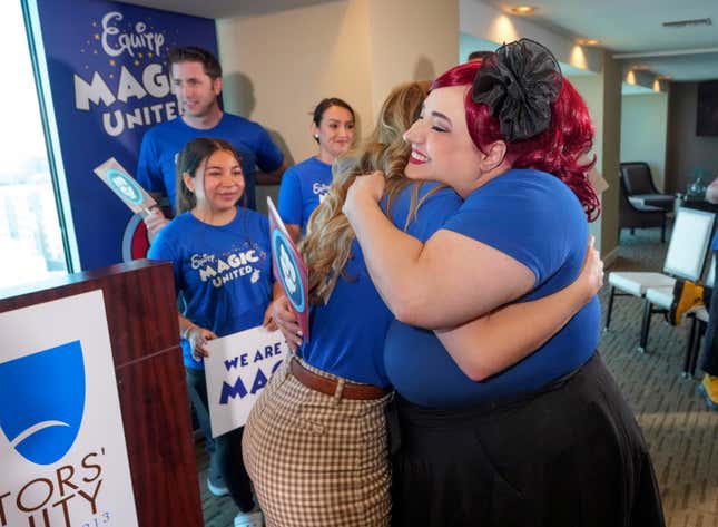 Disneyland Resort Cast Members, Courtney Griffith, left, hugs Angela Nichols after a news conference in Anaheim, Calif., Wednesday, April 17, 2024. Workers who help bring Disneyland&#39;s beloved characters to life said Wednesday they collected enough signatures to support their push for a union. (AP Photo/Damian Dovarganes)