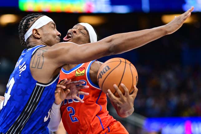 ORLANDO, FLORIDA - FEBRUARY 13: Shai Gilgeous-Alexander #2 of the Oklahoma City Thunder draws the foul from Wendell Carter Jr. #34 of the Orlando Magic in the second half at Kia Center on February 13, 2024 in Orlando, Florida. NOTE TO USER: User expressly acknowledges and agrees that, by downloading and or using this photograph, User is consenting to the terms and conditions of the Getty Images License Agreement. (Photo by Julio Aguilar/Getty Images)