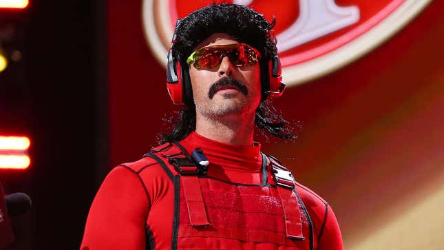 Dr Disrespect appears in a red costume at an event. 