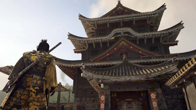 Yasuke stares up at a tall building.