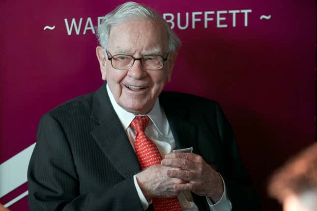 FILE - Warren Buffett, chairman and CEO of Berkshire Hathaway, smiles as he plays bridge following the annual Berkshire Hathaway shareholders meeting in Omaha, Neb., May 5, 2019. Buffett&#39;s company reported a $12.8 billion loss Saturday, Nov. 4, 2023, as the paper value of its investments fell, but the companies it owns — particularly the insurers — generally performed well.(AP Photo/Nati Harnik, File)