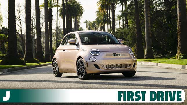 Front 3/4 view of a gold 2024 Fiat 500e