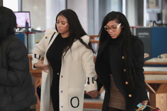 Joycelyn Savage (L) and Azriel Clary arrive for a bond hearing for R&amp;B singer R. Kelly at the Leighton Criminal Court Building on February 23, 2019, in Chicago.