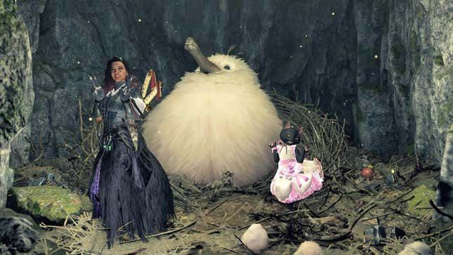 A hunter and their Palico pose next to the community-coined Gigacrake.