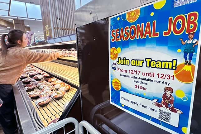 A hiring sign is displayed at a grocery store in Arlington Heights, Ill., Monday, Dec. 4, 2023. On Thursday, the Labor Department reports on the number of people who applied for unemployment benefits last week.(AP Photo/Nam Y. Huh)