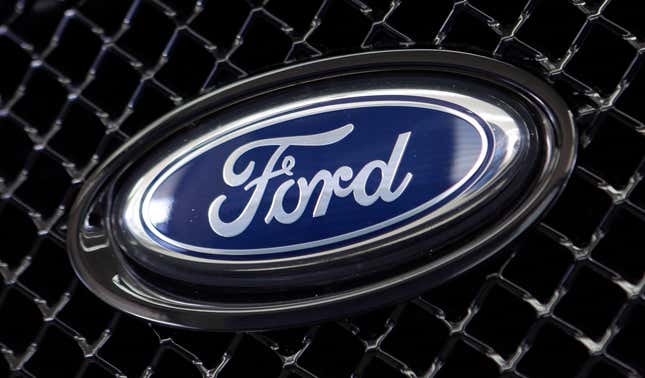 FILE - The Ford logo on a vehicle at a dealership in Hialeah, Fla., Aug. 21, 2014. The U.S. government is investigating complaints that steering wheels can come loose on some Ford Fusion sedans. U.S. auto safety regulators have closed a seven-year investigation into complaints about power-assisted steering failures in Ford Fusions without seeking additional recalls. (AP Photo/Alan Diaz, File)