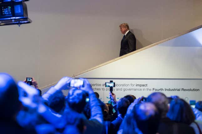 US president Donald Trump walks down stairs during the 48th Annual Meeting of the World Economic Forum.
