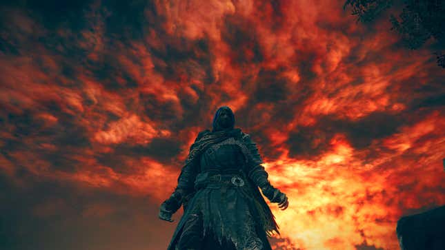 A red sky roars around a cloaked figure.