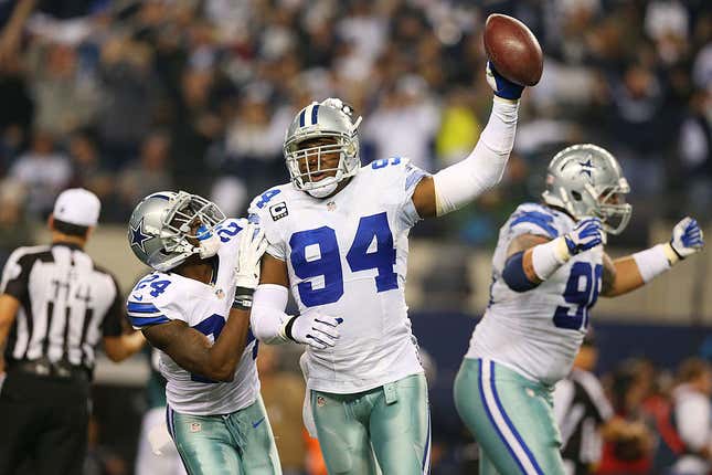 DeMarcus Ware (center) as a Cowboy in 2013.